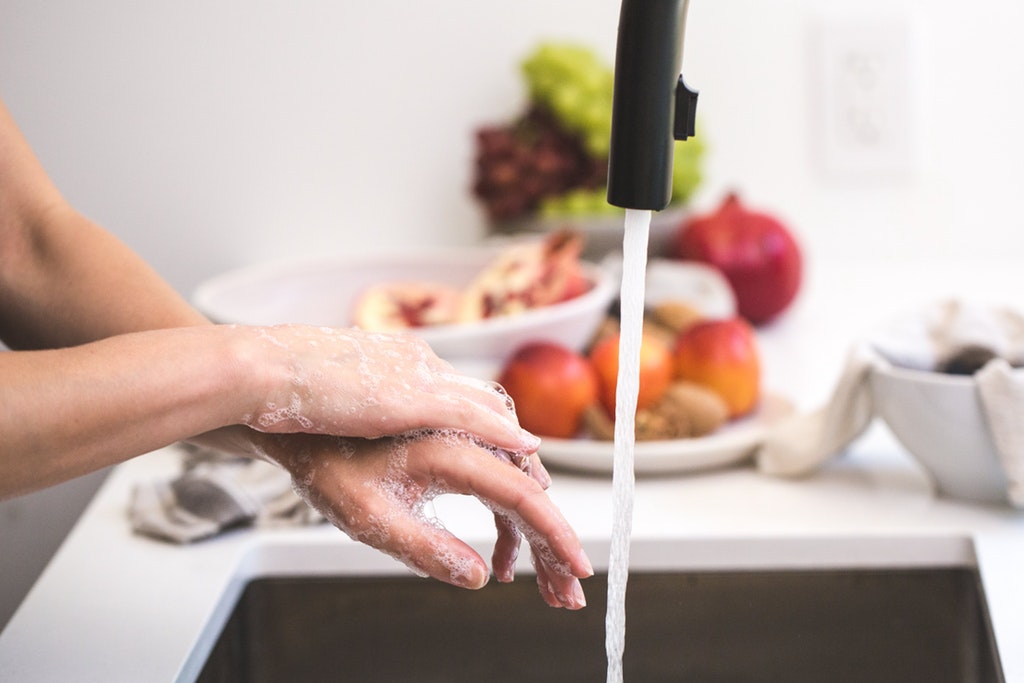 person washing his hands