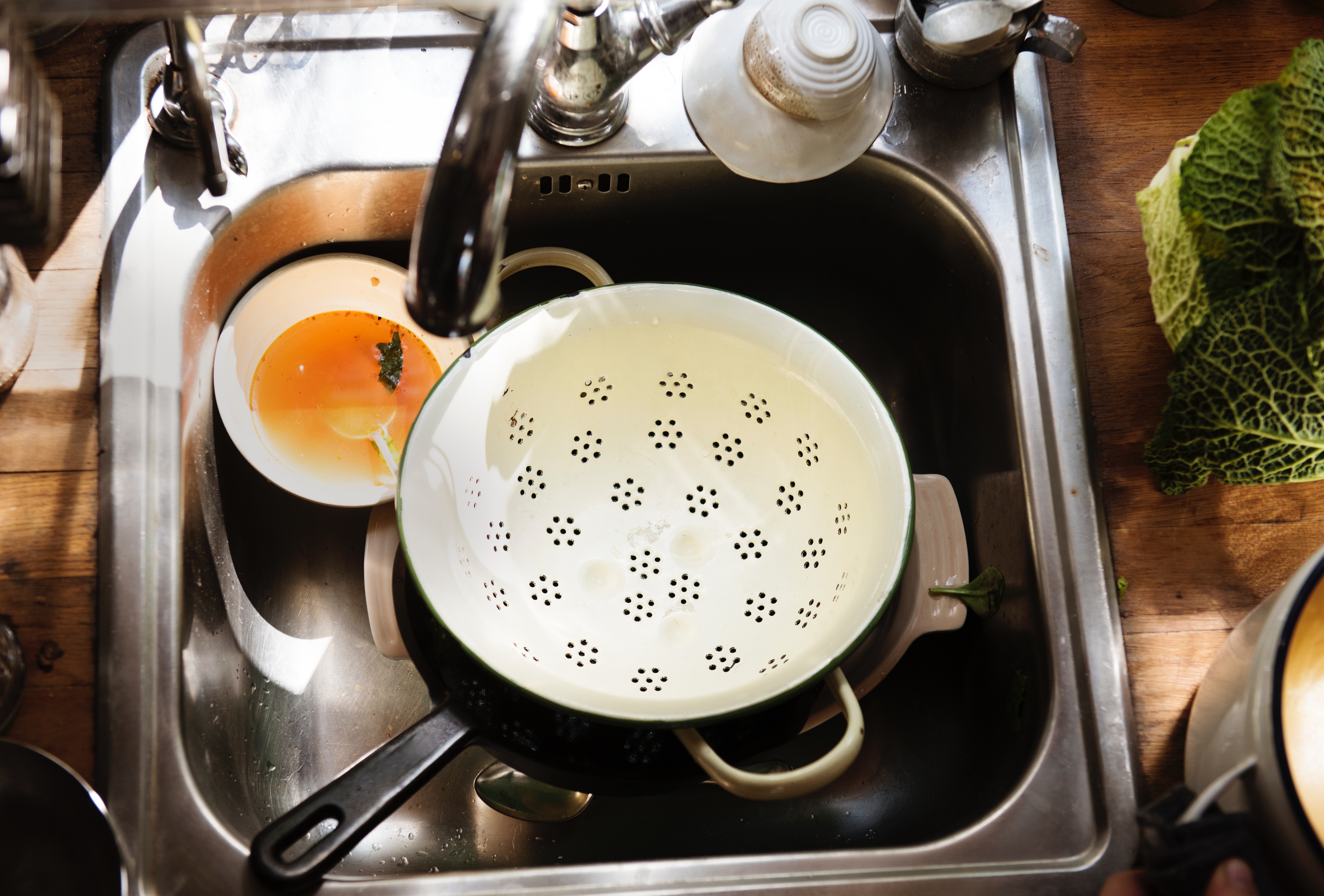 unwashed dishes on the sink