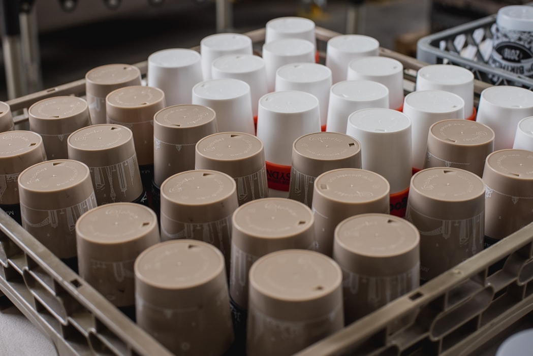shallow focus photo of white and gray plastic containers